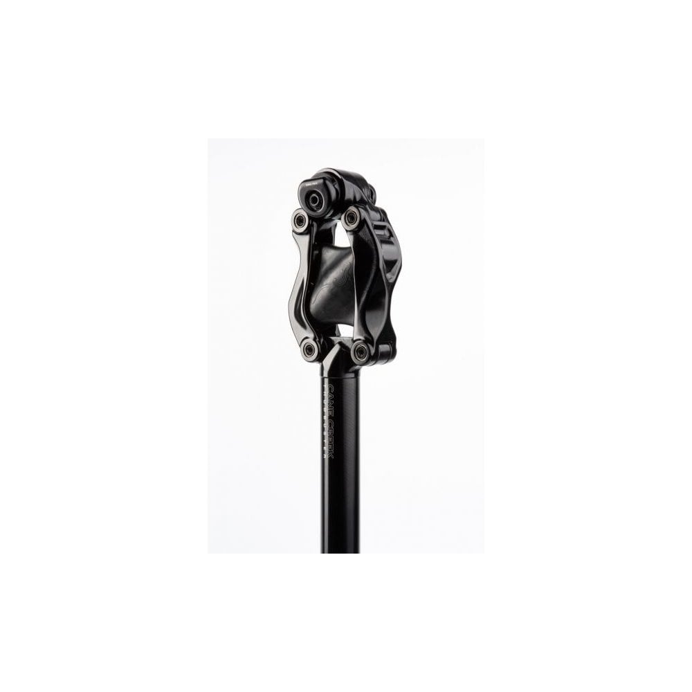 Cane Creek Thudbuster LT G4 suspension seatpost with tool-free elastomer adjustment, shown with mounting tools.