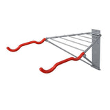 Delta Pablo wall mount bike rack in silver and black with folding design and shelf, perfect for organizing bikes and accessories.