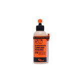 Orange Seal Endurance tubeless sealant in a container, designed for puncture protection and cold weather use in bike components.