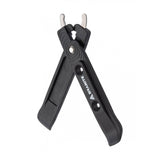 Granite workshop stainless steel chain removal tips and tyre lever for puncture repair on a bicycle wheel.