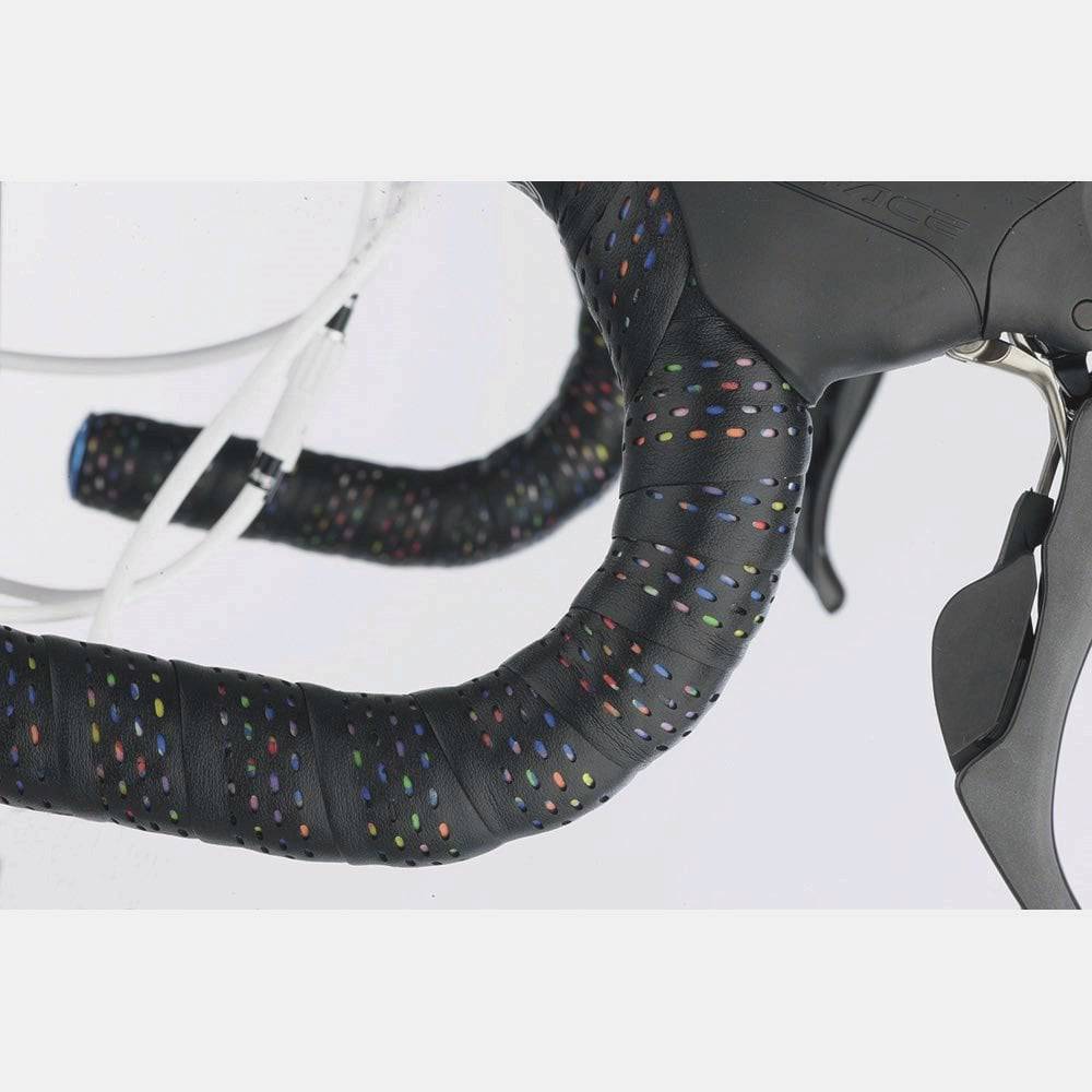 Cinelli Caleido bar tape with multi-density eco-leather and vibration damping, designed for road bike handlebars.