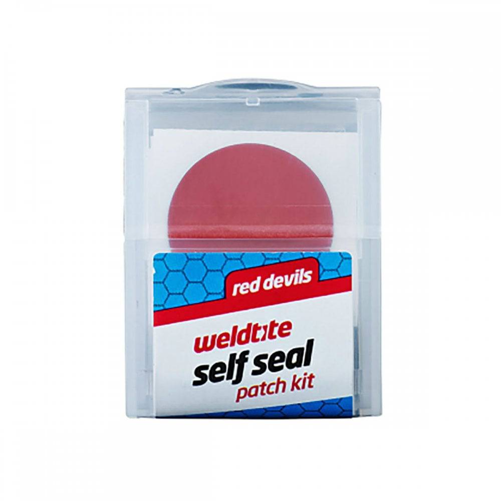 Weldtite Red Devil S/Seal patch repair kit for bicycle inner tubes, displayed in a workshop display box with 12 kits.