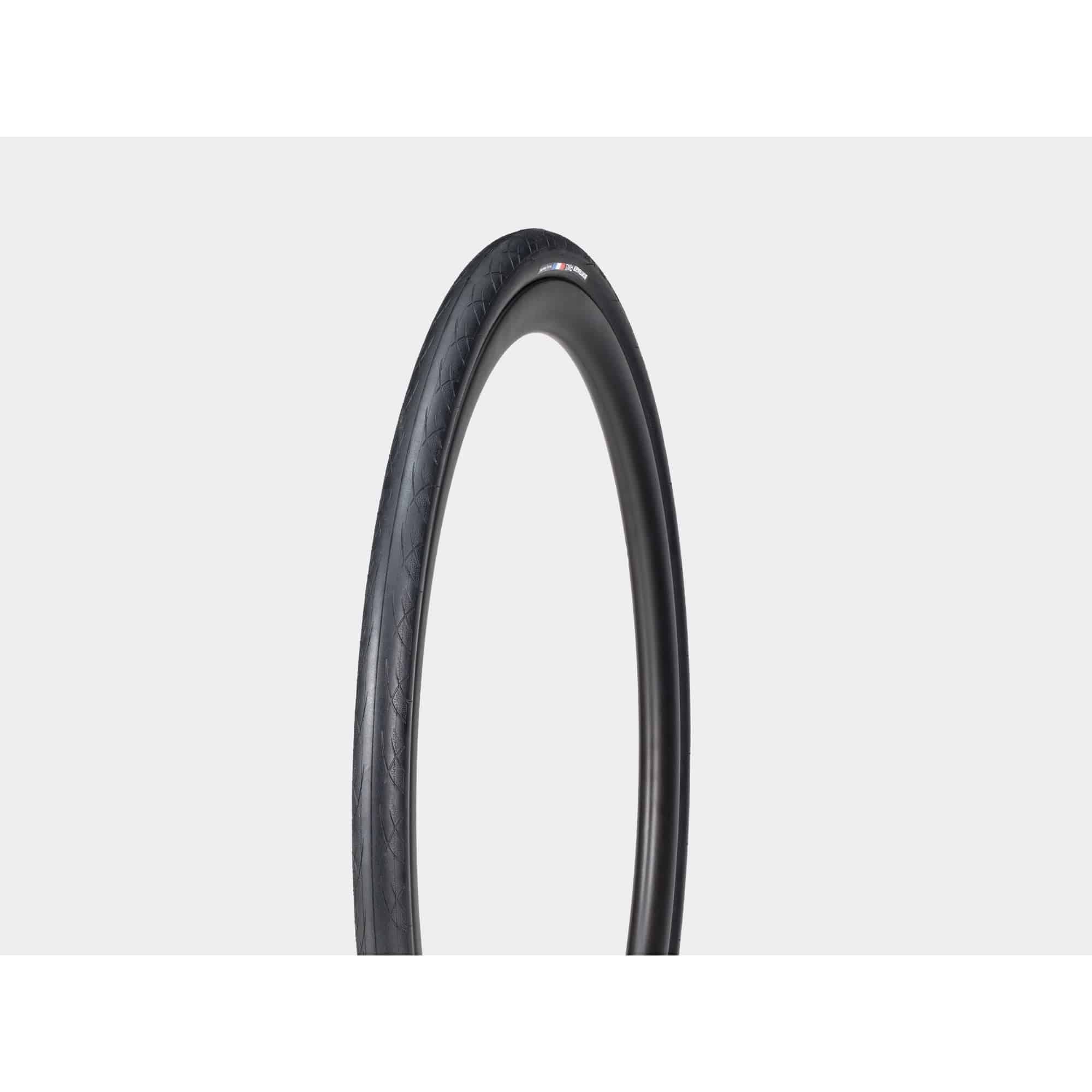 Bontrager AW1 Hard-Case Road Tire with Triple Flat Protection mounted on a bicycle wheel for durability and puncture resistance.