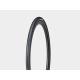 Bontrager AW1 Hard-Case Road Tire with Triple Flat Protection mounted on a bicycle wheel for durability and puncture resistance.