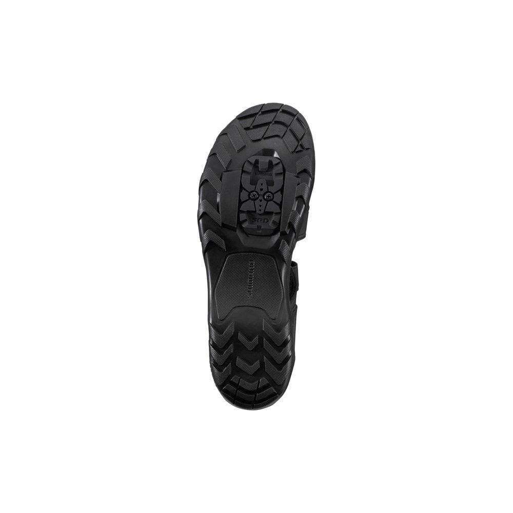 Shimano SD5 unisex MTB shoes with black and gray design, featuring SPD cleats for efficient power transfer during mountain biking.