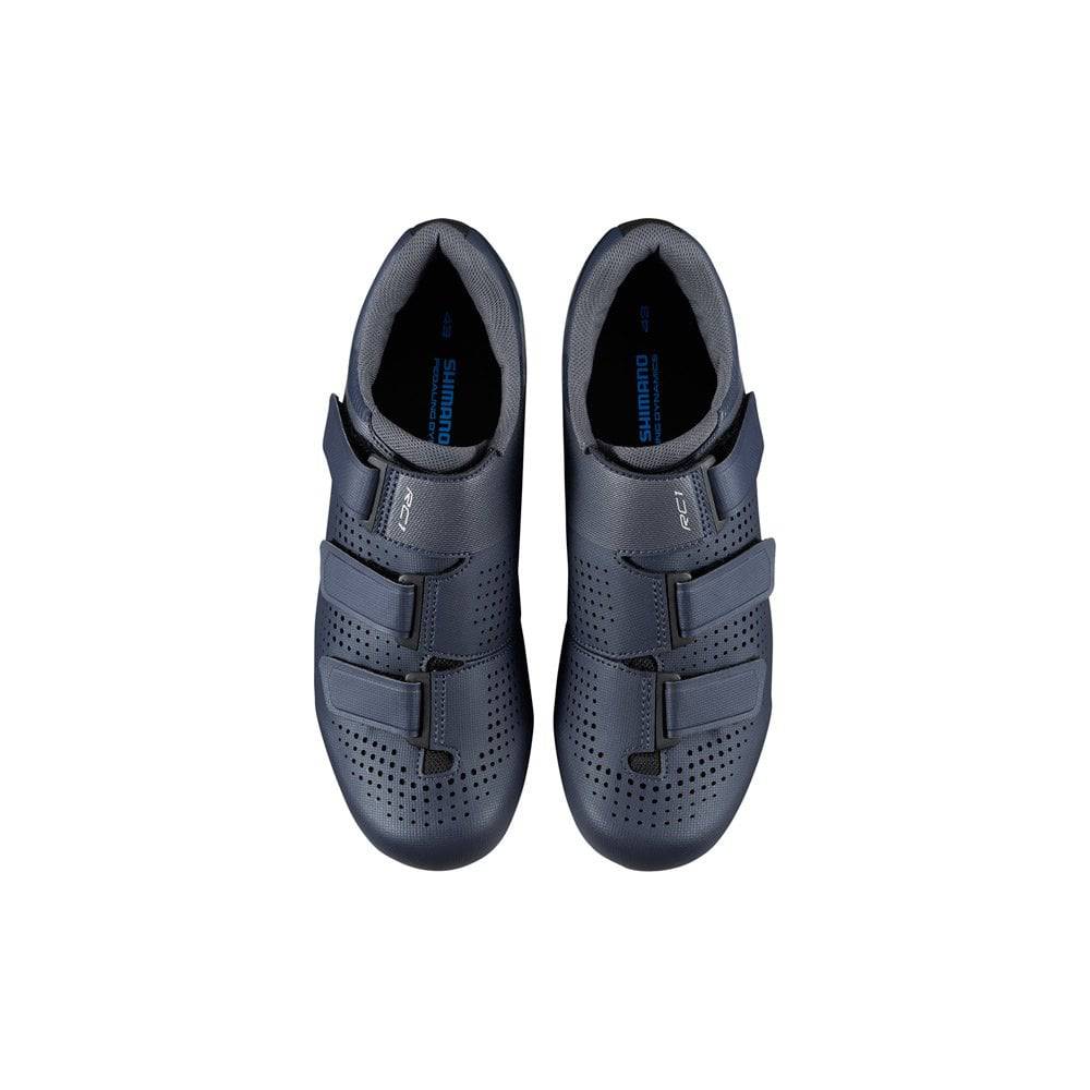 Shimano RC1 SPD-SL road cycling shoes with reflective straps, breathable synthetic upper, and stiff sole for competitive riding.