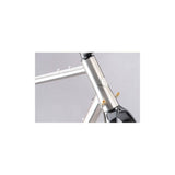 Genesis Croix De Fer titanium gravel frameset with carbon fork and disc brake mounts, showcasing lightweight bike components.