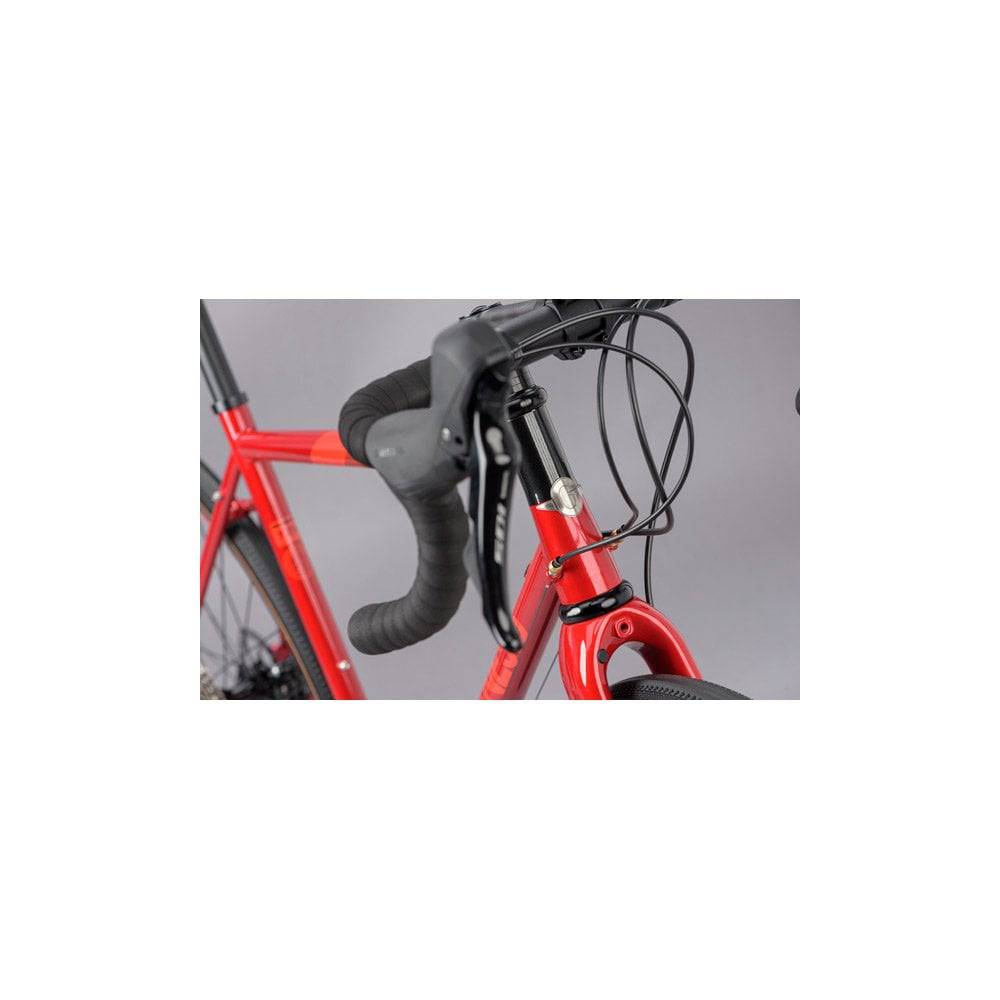 Genesis Equilibrium disc road bike with Shimano 105 R7000 components and rack mounts, ideal for versatile cycling.