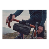 Brooks Scape waterproof handlebar pouch in mud green, bike storage bag attached to a bicycle handlebar.