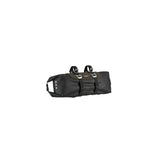 Brooks Scape handlebar roll bag in waterproof mud green bikepacking gear attached to a bike handlebar.