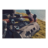 Brooks Scape Handlebar Roll Bag in mud green, waterproof bikepacking accessory mounted on a bike handlebar.