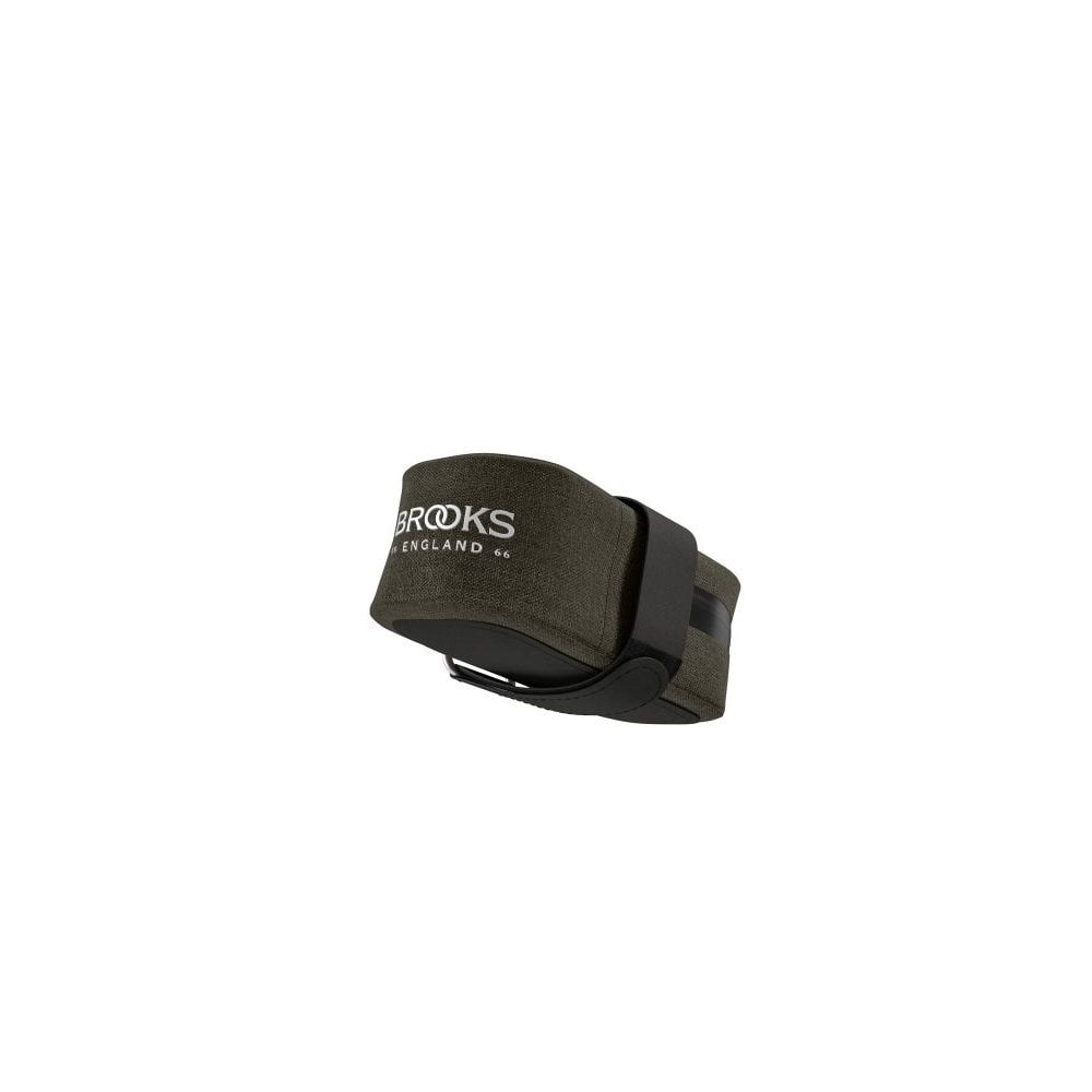 Brooks Scape waterproof saddle pocket bag in mud green attached to bike saddle for bikepacking and gravel riding accessories.