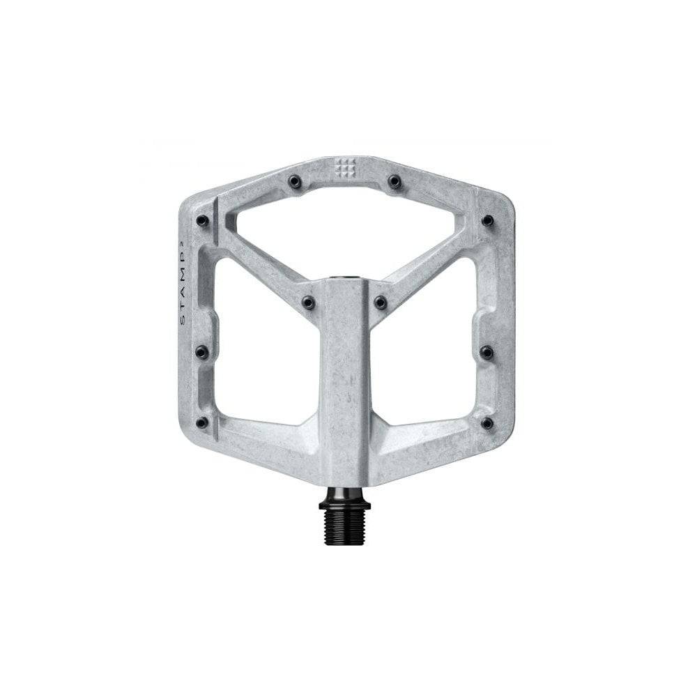 Crank Brothers Stamp 2 flat MTB pedal with adjustable pins, silver metal platform designed for mountain and trail biking.