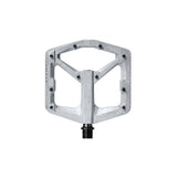 Crank Brothers Stamp 2 flat MTB pedal with adjustable pins, silver metal platform designed for mountain and trail biking.
