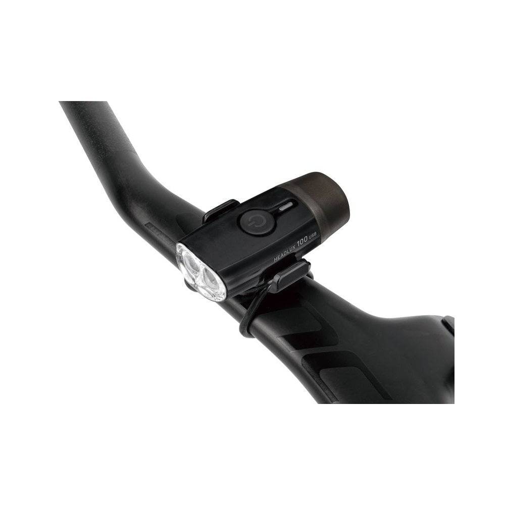Topeak HeadLux 100 USB bike light with 100 lumens, front bicycle light, rechargeable via USB, designed for cycling safety.