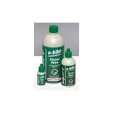Squirt Workshop biodegradable wax chain lube for e-bike drivetrain protection, shown applied on bicycle chain.