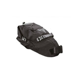 Topeak BackLoader bikepacking seat bag with water-resistant material and quick-release storage system on a bicycle saddle