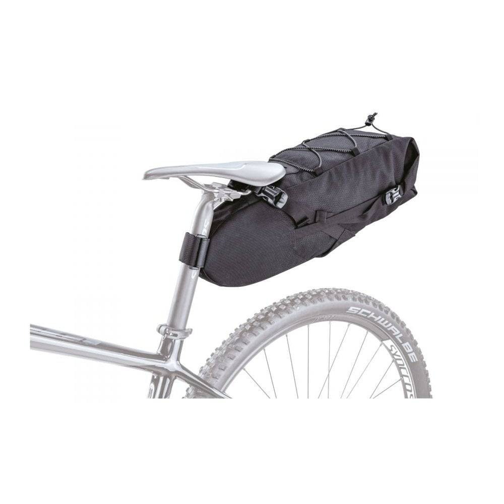 Topeak BackLoader bikepacking seat bag with water-resistant fabric and quick-release storage system mounted on a bicycle seat