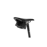 Fizik waterproof cycling saddle bag with Velcro attachment, compact black accessory for bike storage.