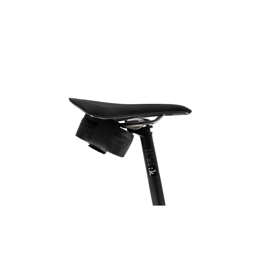Fizik waterproof black saddle bag with Velcro strap for cycling storage, attached under bike saddle for convenient access.