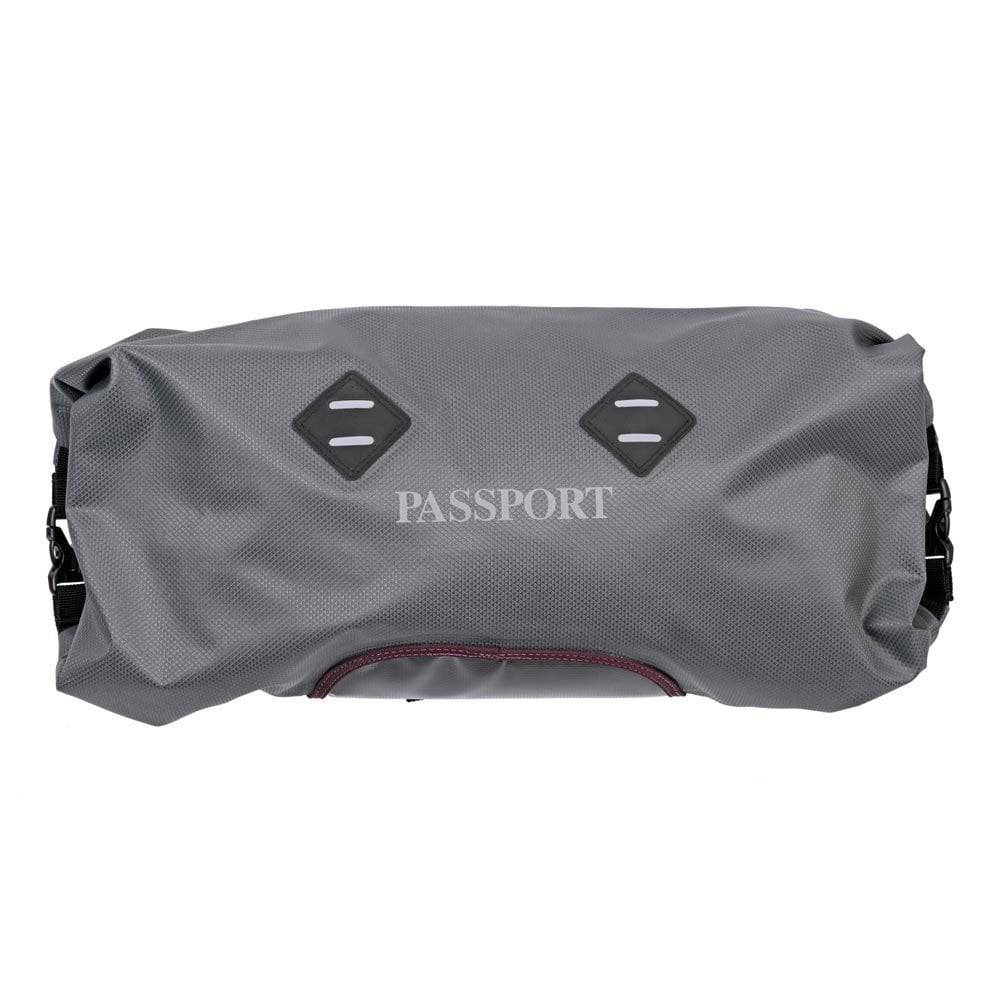 Passport waterproof handlebar pack with LED light mounts, bicycle accessory designed for secure storage during rides.