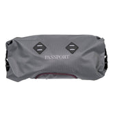 Passport waterproof handlebar pack with LED light mounts, bicycle accessory designed for secure storage during rides.