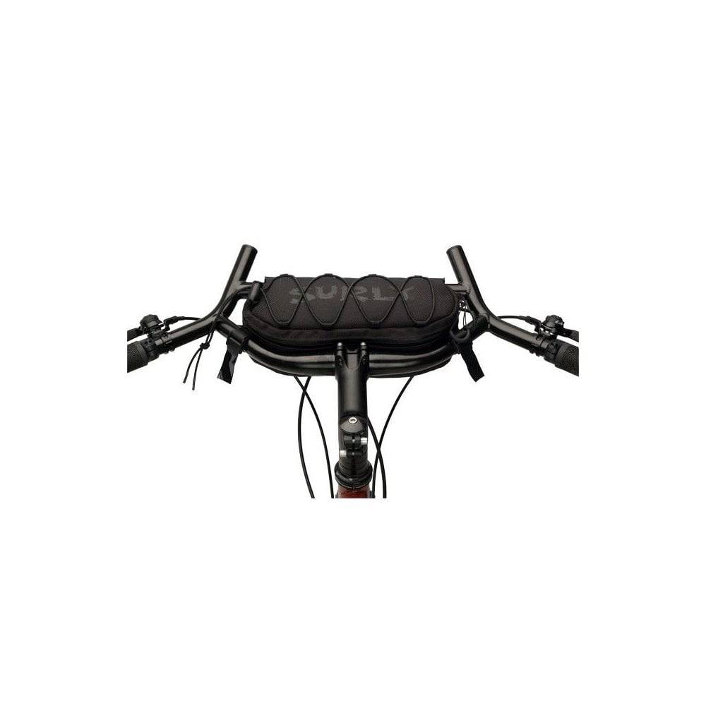 Surly Moloko handlebar bag for bikes, mounted on bike handlebar, with zipper closure and durable fabric for cycling accessories.