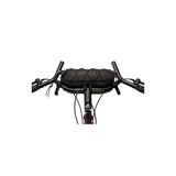 Surly Moloko handlebar bag for bikes, mounted on bike handlebar, with zipper closure and durable fabric for cycling accessories.
