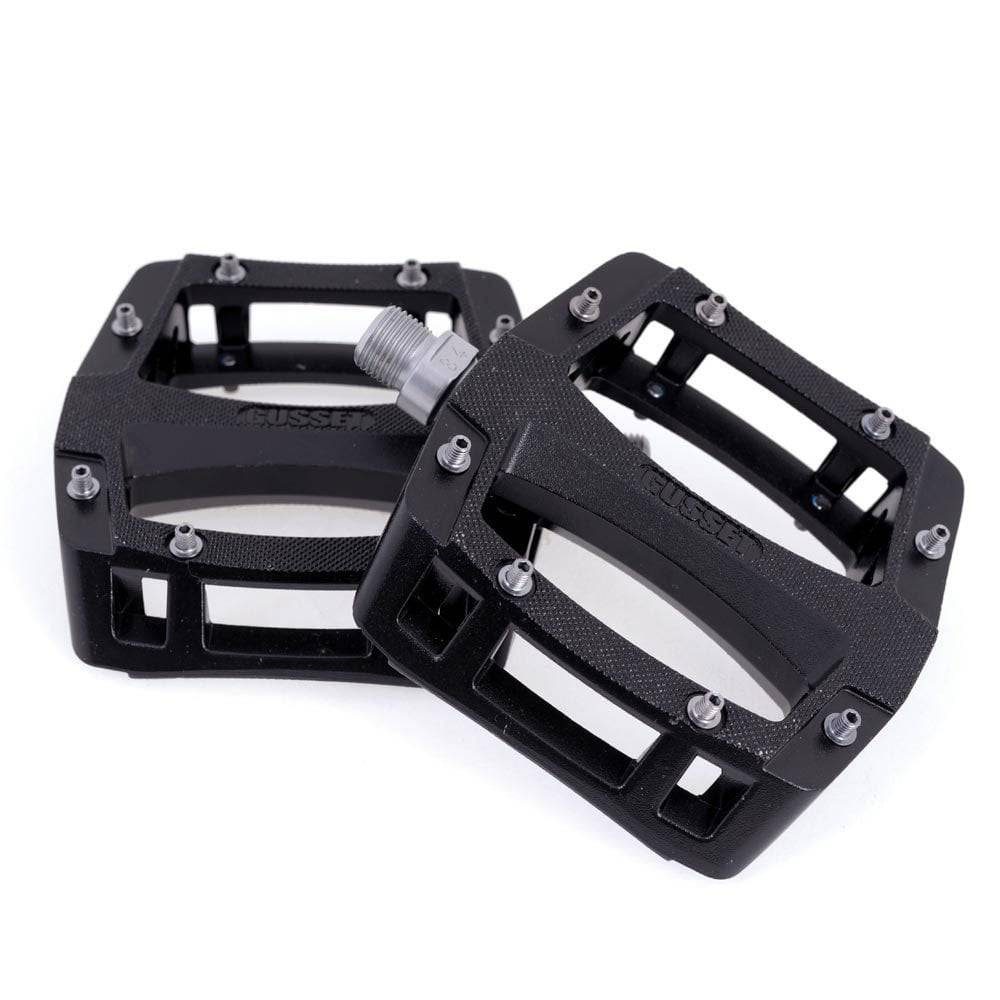 Gusset Components Slim Jim flat pedal with replaceable pins and Cr-Mo axle, designed for mountain biking and BMX riding.