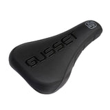 Gusset Components S2 DJ saddle with pivotal stealth fit and anti-slide grip, designed for BMX and mountain biking.