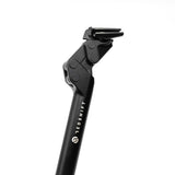 Redshift Sports ShockStop suspension seatpost for gravel, road, and e-bikes, showing its adjustable suspension and sleek design.