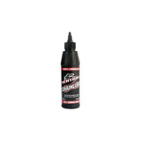 Rohloff synthetic biodegradable chain lube for Lubmatic system, shown in workshop setting with applicator bottle and tools.