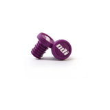 Pair of ODI BMX 2-color push-in handlebar plugs for BMX bike grips, showcasing colorful handlebar end caps.