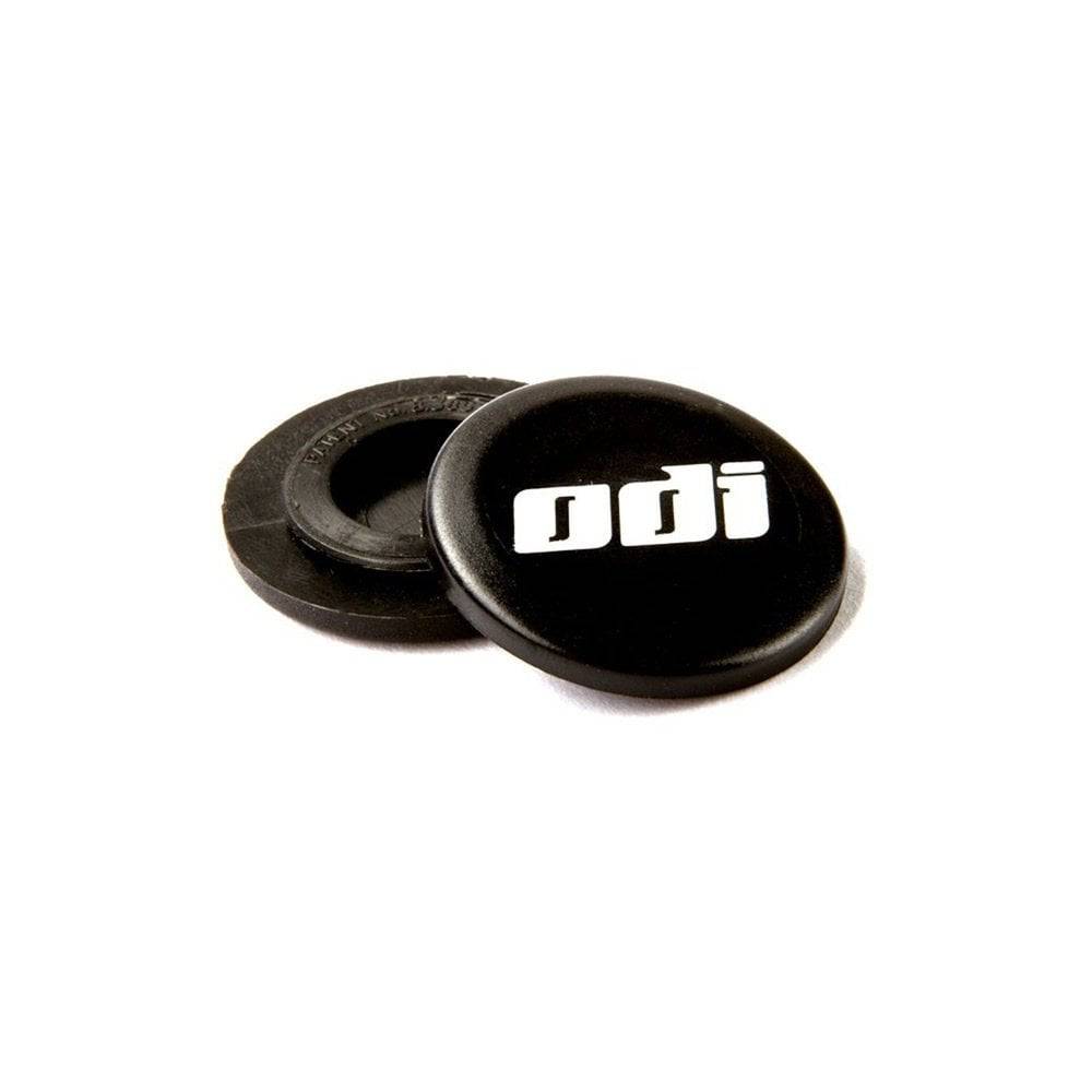 Pair of black ODI Snap Cap replacement end plugs for lock-on grips, designed for secure and stylish bike handlebar ends.