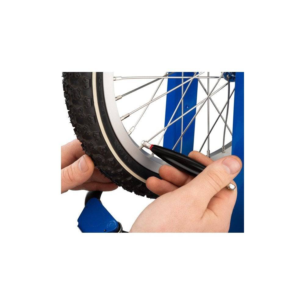 Park Tool SW-9 double-ended spoke wrench for 0.127 and 0.136-inch nipples, used in bike wheel workshop maintenance.