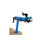Park Tool PCS-12.2 home mechanic bike repair stand with micro-adjust clamp on workshop bench-mount for bike maintenance.