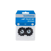 Shimano GRX RD-RX400 rear derailleur pulley set showing metal and plastic components for bicycle gear shifting.