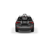 Thule OutWay rear-mount platform bike carrier with two bike slots and lockable cables for secure transport.