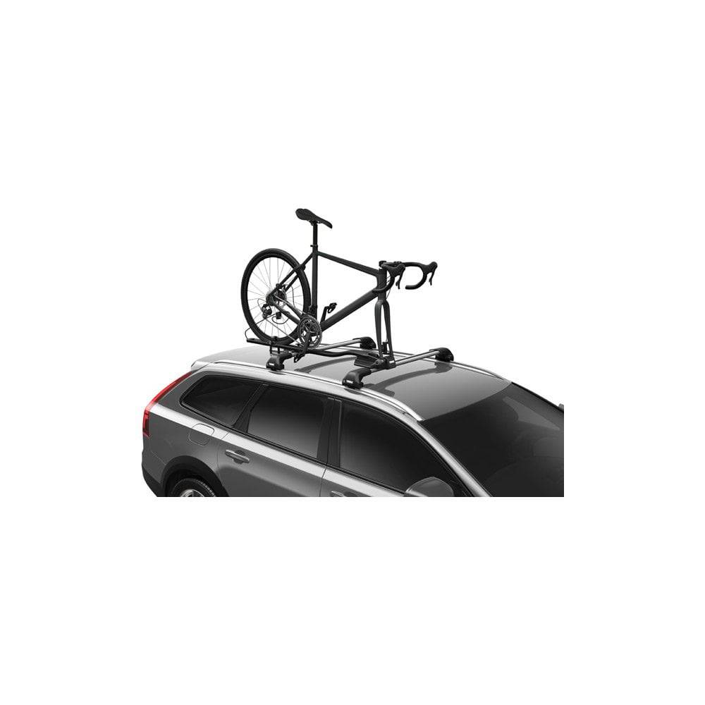 Thule 564 FastRide fork mount bike carrier with lock, designed for quick release front forks, shown mounted on a vehicle roof rack.