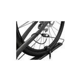 Thule 564 FastRide bike carrier with lock mounted on a vehicle roof rack, holding a quick-release front fork bike.