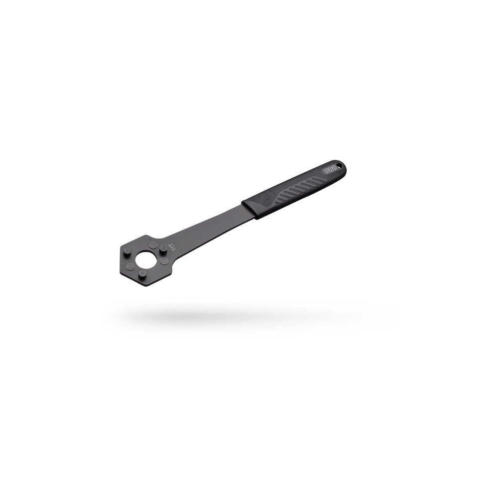 PRO cassette wrench for 10T and 11T cassettes, with 3-pin secure grip tool, used in bike workshop maintenance.