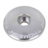 Silver Thomson 1 1/8 bike stem cap for securing bike stems and seatposts, shown on a white background.