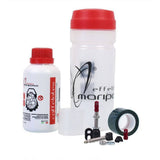 Effetto Mariposa Caffelatex tubeless sealant and repair kit for MTB and road bike wheels, shown in a workshop setting.