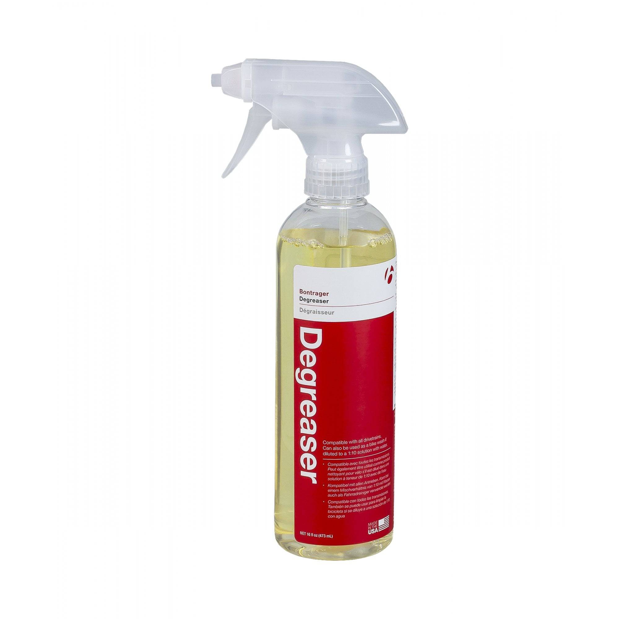 Bontrager bike degreaser and lubrication cleaner with citrus scent for drivetrain maintenance, shown in a workshop setting.