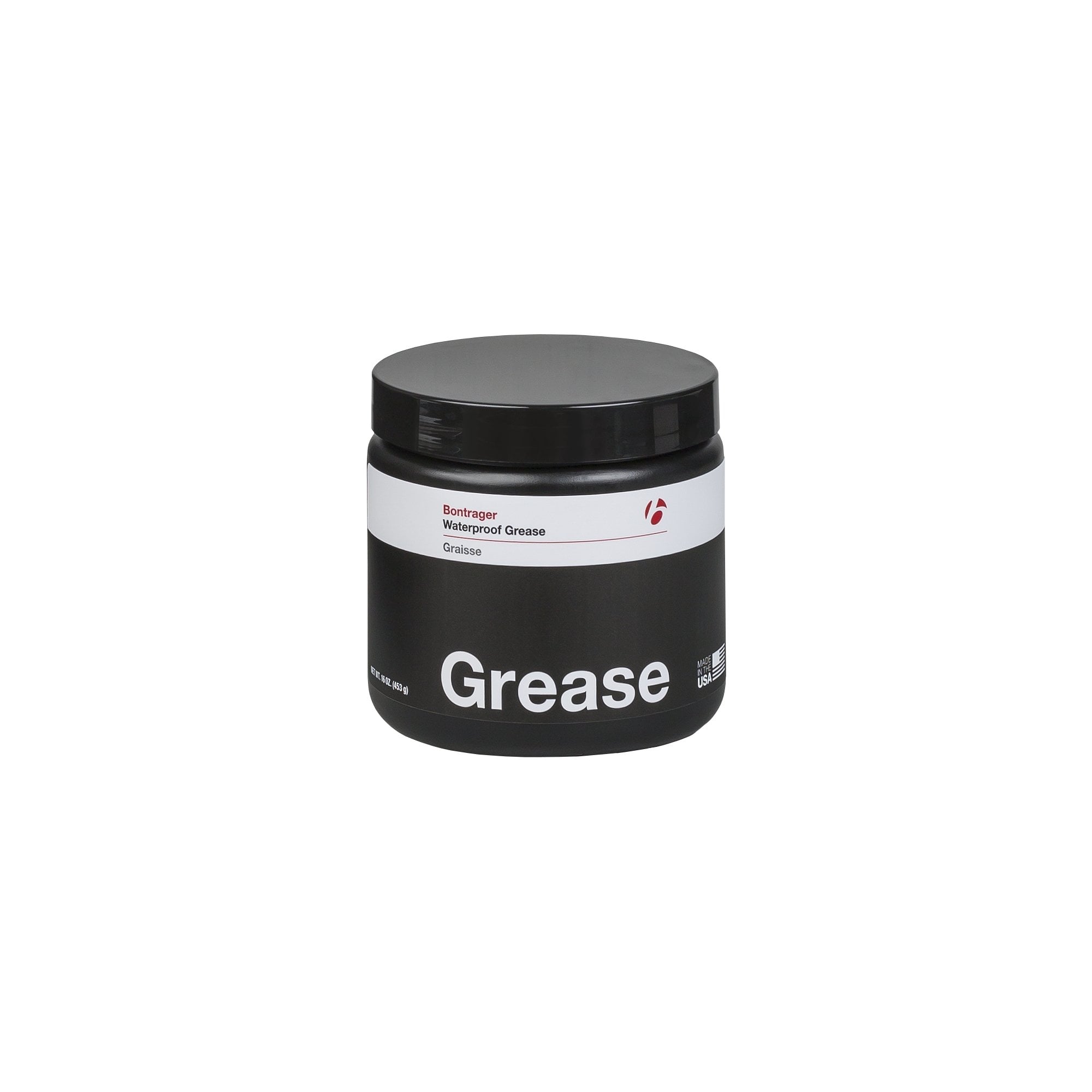 Bontrager bicycle grease lubricant for waterproof, low friction, and carbon fiber bike maintenance, shown in a workshop setting.