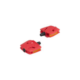 Trek kids' small flat platform pedals for children's bikes, durable plastic pedals with textured surface for grip.