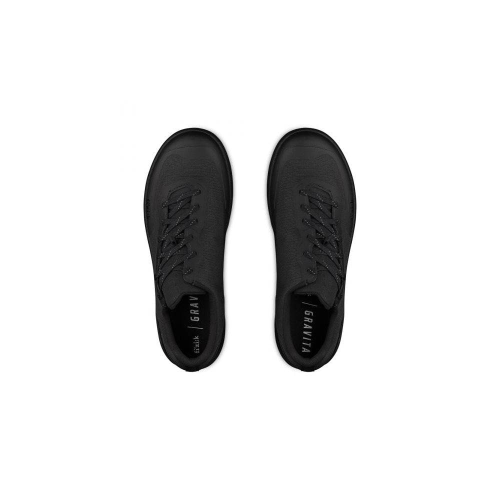 Fizik Gravita Versor MTB shoes with Vibram Megagrip outsole, black trail riding shoes with secure lacing and rugged tread pattern.