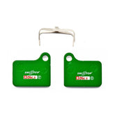 SwissStop Disc 5 Organic brake pads for Shimano Deore BR-M555, pair of green components for bicycle disc brakes.