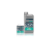Motorex Racing Shock Oil in silver and green for high-performance motorcycle suspension, 1 liter bottle on workshop setting.
