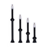 Vision tubeless valve in black for TLR carbon rims, designed for tubeless wheel setups on high-performance bicycles.